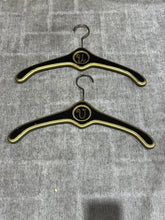 Load image into Gallery viewer, MCM Regency Black and Gold Wood Clothes Hangers - Monogrammed with U and V
